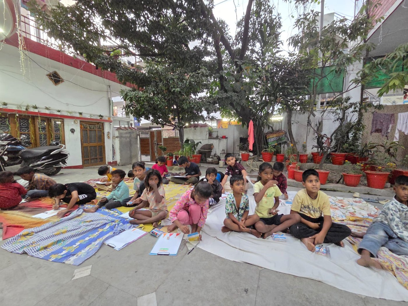Kala Pratiyogita — children painting under the trees